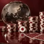地球儀の前に高さの異なるポーカーチップと日の丸をあしらったメダリオンを配し、日本人選手の世界ランキングを象徴した高級感のある画像。